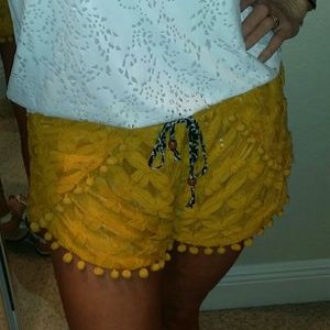 Summer shorts with pom poms